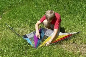 Free Time Activities For Kids Impressions: Boy assembles a stunt kite