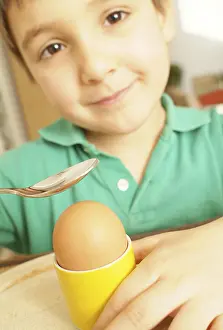 Balanced Diet For Kids Impressions: Boy eats an egg