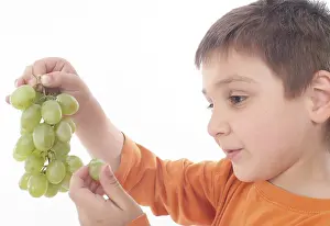 Balanced Diet For Kids Impressions: Boy eats grapes