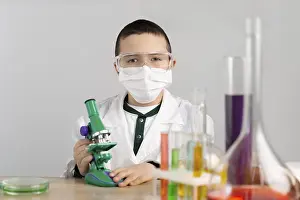 Laboratory Equipment Impressions: Boy laboratory with microscope