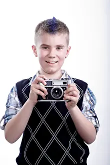 Dark Studio Shot Impressions: Boy with old camera