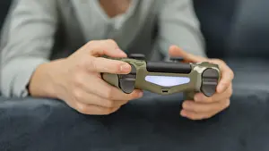 Child Playing Video Games Impressions: Boy playing with controller
