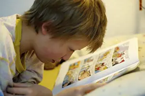 Boy Reading In Bed Impressions: Boy reading in bed