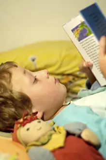 Boy Reading In Bed Impressions: Boy reading in bed