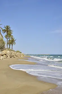 Spanish Coast Impressions: Breaking waves on a sandy beach