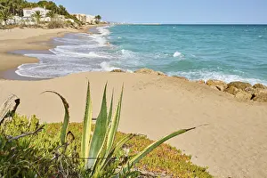 Sandy Beach Spain Impressions: Breaking waves on a sandy beach