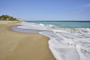 Sandy Ocean Shores Impressions: Breaking waves on a sandy beach