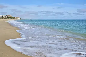 Spanish Coastline Impressions: Breaking waves on a sandy beach