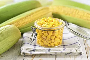 Tin Can Food Impressions: Canned sweet corn in jar on a white table