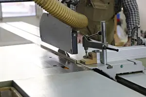 Circular Saw Usage Impressions: Carpenter at work in his carpentry workshop