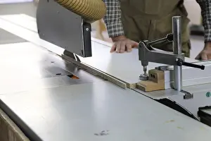 Circular Saw Usage Impressions: Carpenter at work in his carpentry workshop