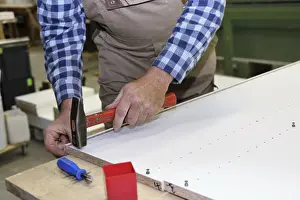 Traditional Craftsmanship Techniques Impressions: Carpenter at work in his carpentry workshop