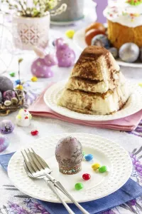 Christian Easter Celebration Impressions: Table setting. Easter table with Easter eggs and easter orthodox sweet bread