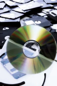 Data Storage Solutions Impressions: A CD, floppy disk in background