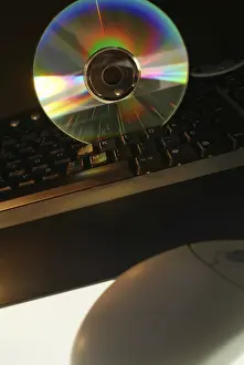 Digital Data Storage Device Impressions: Cd rome on computer keyboard
