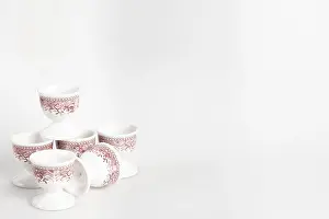 Bright Studio Background Impressions: Ceramic egg cup with reddish pattern on white background