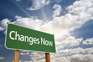 Cloudy Sky With Sun Rays Impressions: Changes now green road sign with dramatic clouds