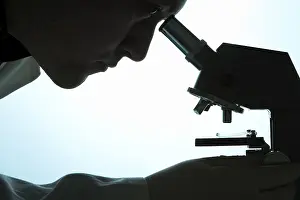 Indoor Studio Photography Impressions: Chemist looking through a microscope