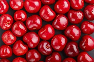 Flat Lay Concept Impressions: Cherry pattern on black background