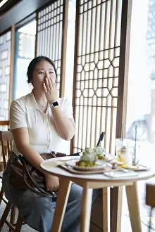 Female Portrait Photography Impressions: In a chic cafe at a window table