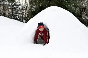 Happy Children Playing Outside Impressions: Child plays in igloo