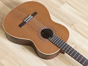 Plucked String Instrument Impressions: A classical guitar with six nylon strings