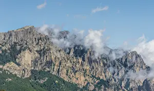 Mountain Pass Scenery Impressions: Cliffs and rocks in front of clouds