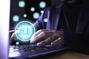 Digital Technology Impressions: Close up of a man using a computer with artificial intelligence icons