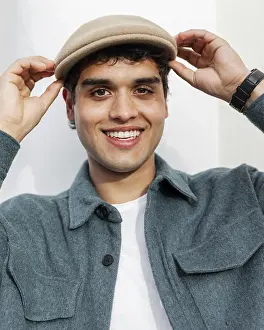 Close Up Man Impressions: Close up smiley man posing with hat