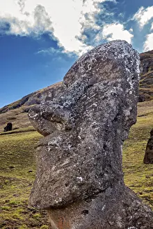 Pacific Ocean Rock Formations Impressions: Close-up of a Moai statue with dramatic cloudscape in the background