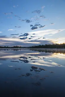 Lapland Forest Lake Impressions: Cloud reflection in a forest lake