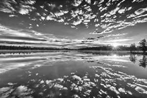 Lapland Forest Lake Impressions: Cloud reflection in a forest lake