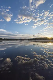Cloudy Sky Over A Lake Impressions: Cloud reflection in a forest lake