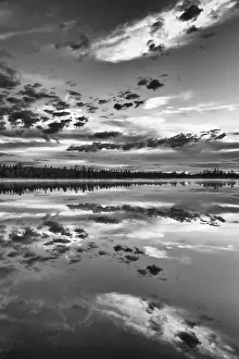 Lapland Forest Lake Impressions: Cloud reflection in a forest lake