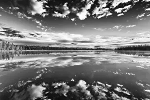 Lapland Forest Lake Impressions: Cloud reflection in a forest lake