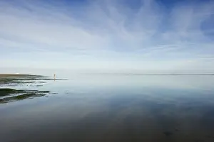 Overcast Sky Waterfront Scene Impressions: Cloud reflection in the mudflats