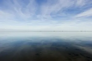 Cloudy Sky Reflections Impressions: Cloud reflection in the mudflats