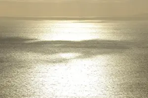 Atmospheric Evening Mood Impressions: Clouds casting shadows over the sea