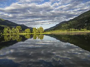 Austria Travel Photography Impressions: Clouds are reflected in the lake