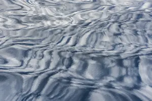 Blue Wave Pattern Impressions: Clouds reflected on the surface of the sea