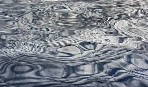 Blue Wave Pattern Impressions: Clouds reflected on the surface of the sea