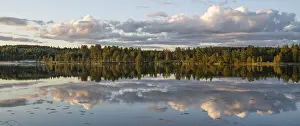 Atmospheric Light Scenery Impressions: Clouds reflected on the water surface