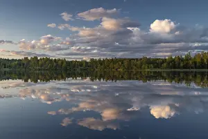 Forest Lake Evening Mood Impressions: Clouds reflected on the water surface