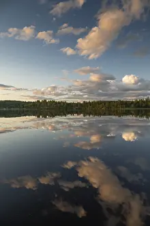 Forest Lake Sweden Impressions: Clouds reflected on the water surface