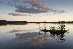 Scandinavian Forest Landscape Impressions: Clouds reflected on the water surface