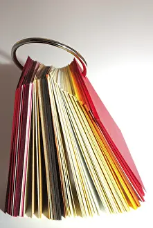 Office Supply Stationery Impressions: Colored paper stack isolated on white background