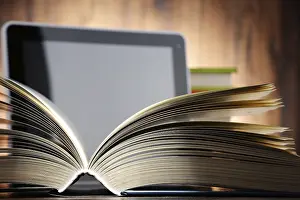 Modern Educational Institution Impressions: Composition with books and tablet computer