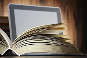 Modern Educational Institution Impressions: Composition with books and tablet computer