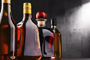 Alcoholic Beverage Display Impressions: Composition with bottles of assorted alcoholic beverages