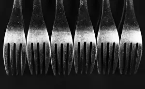 Black Background Studio Shot Impressions: Composition made of forks on the black background